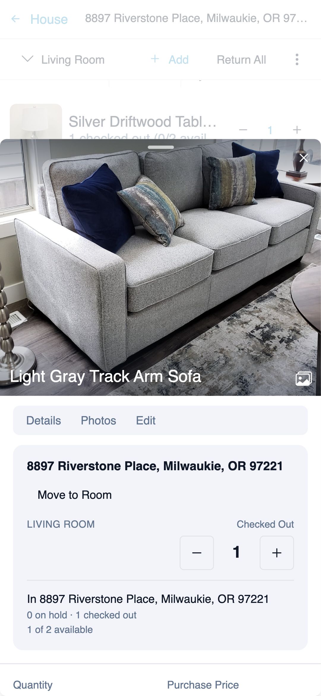 Mobile item detail drawer covering the bottom of the screen, showing the Light Gray Track Arm Sofa photo, its room and house, a Checked Out quantity stepper, and Move to Room and Edit Item actions