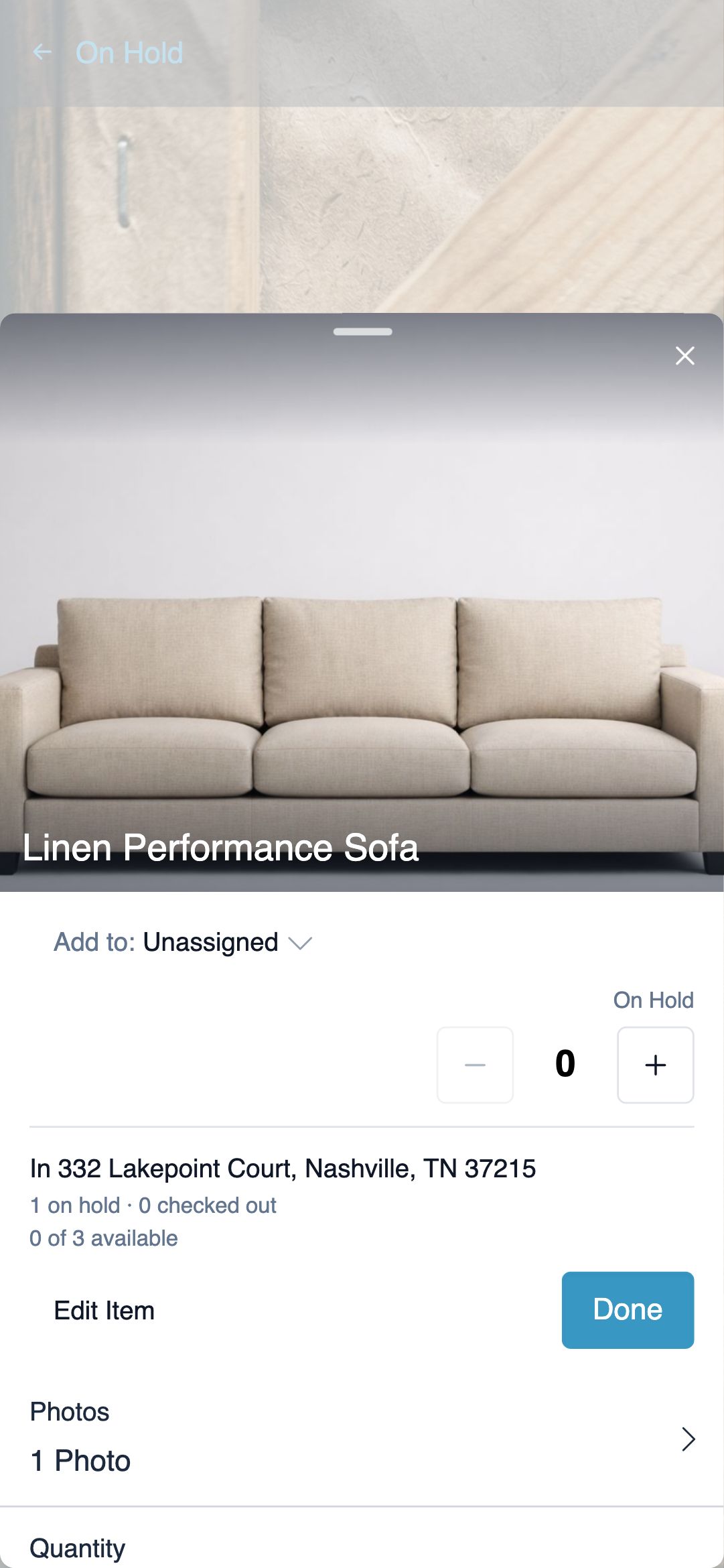Mobile scan-confirm bottom sheet inside a house's Scan Barcodes flow: recognized item photo and name, Add to room selector defaulted to Unassigned, On Hold stepper, and a Done button