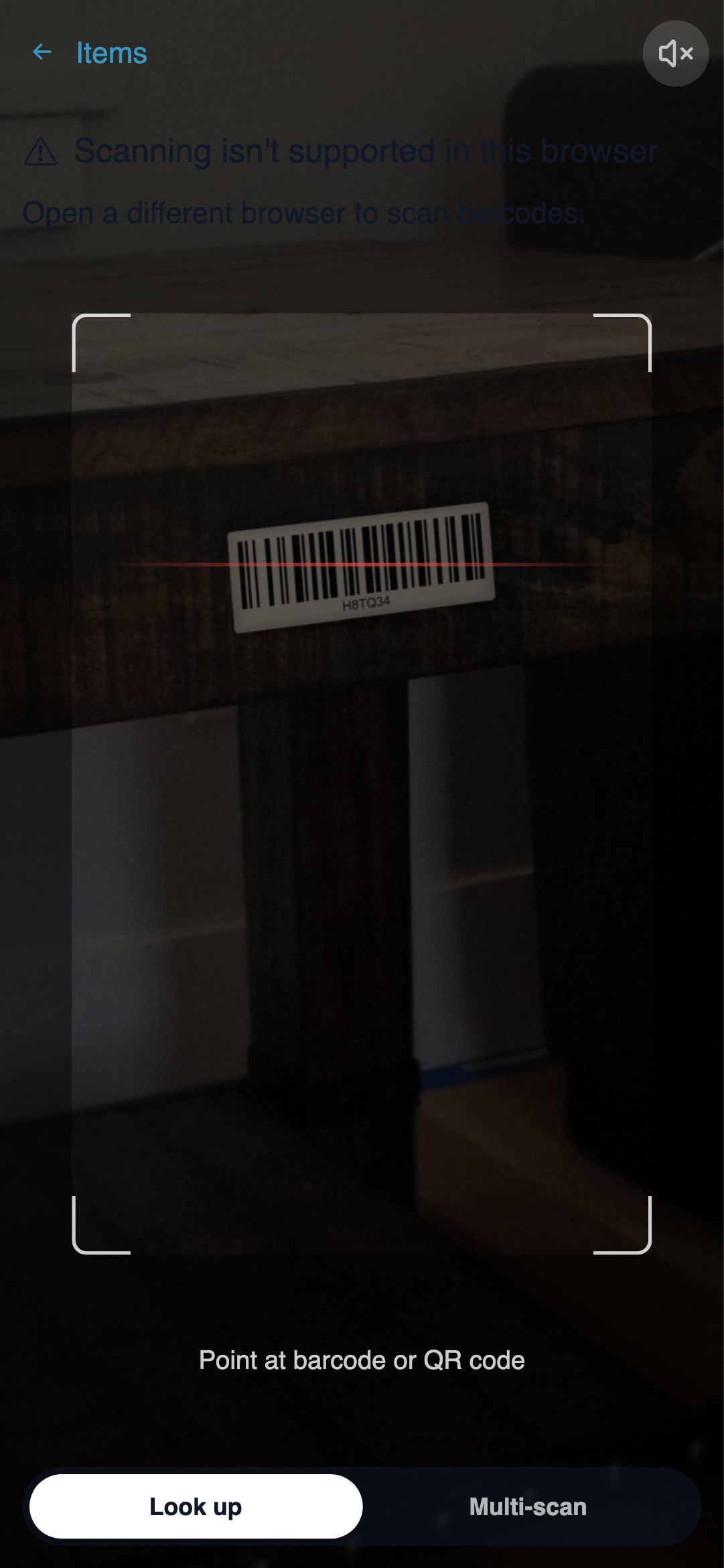 Full-screen barcode scanner viewfinder with a code aligned in the centre